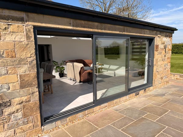 Stone Extension with Sliding Patio Doors